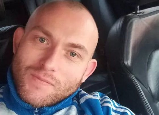 Six arrested after body found in woods
