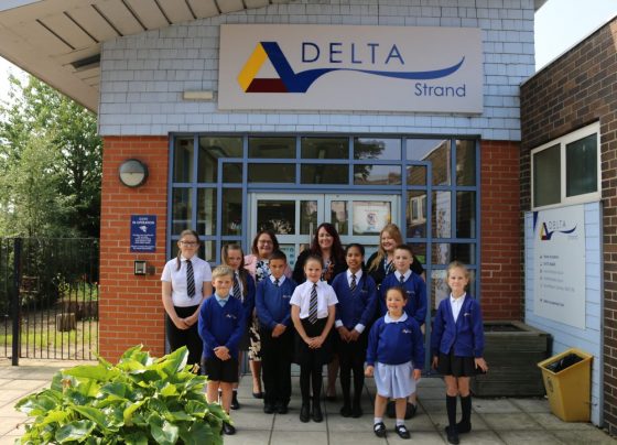 Staff and children at Strand Primary Academy